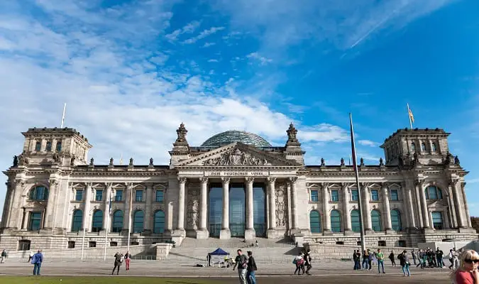 The Reichstag, a historic building that looks like a classical temple, is the seat of the German parliament.